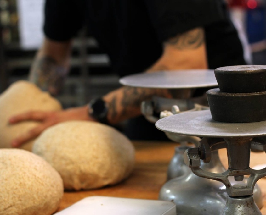 Muffin Top Bakery measuring the perfect amount of base for a cake